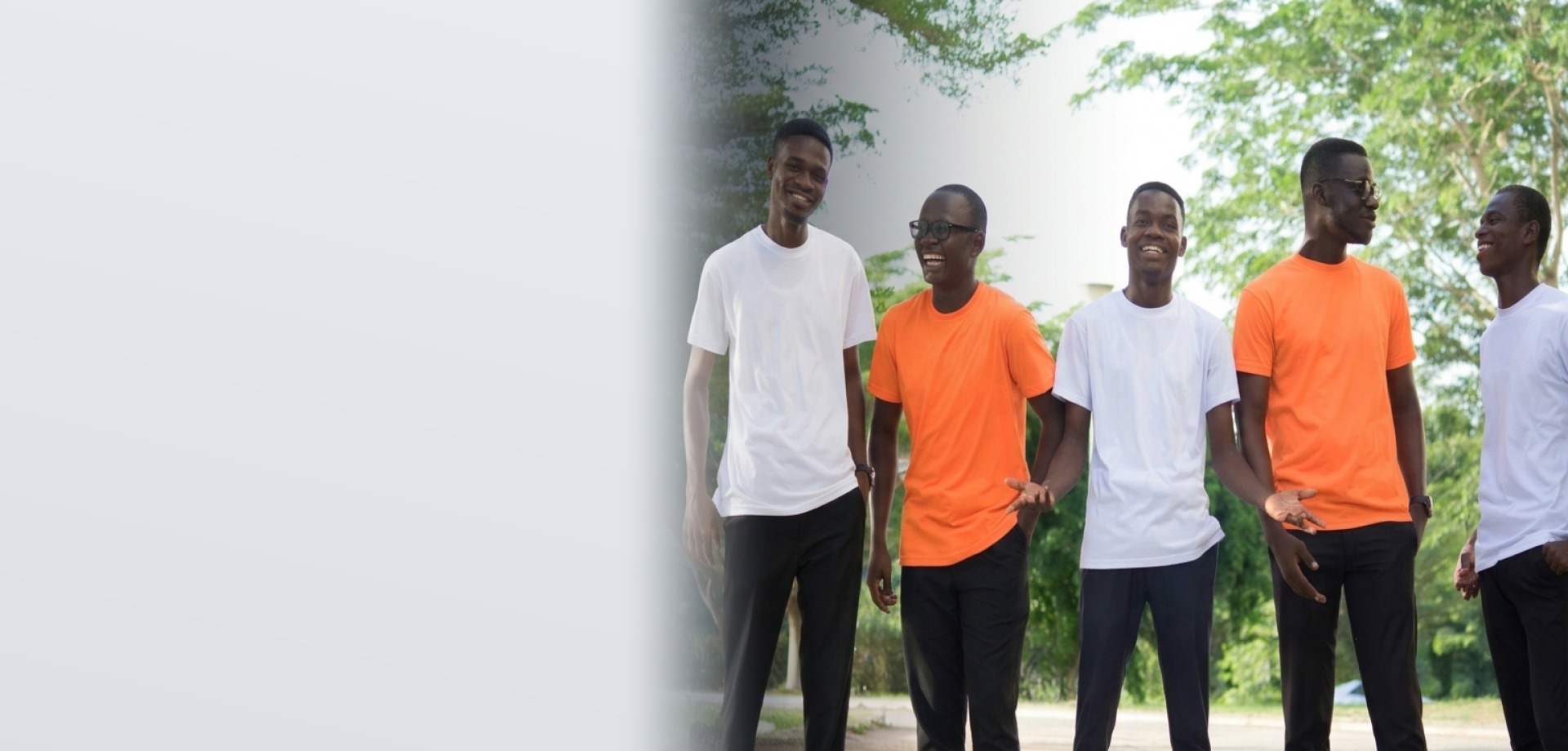 Corporate team in clean orange and white shirts during outdoor team programme