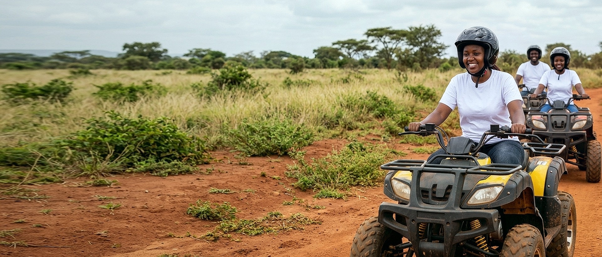 Corporate team members riding ATV quad bikes during an outdoor team building adventure in Kenya